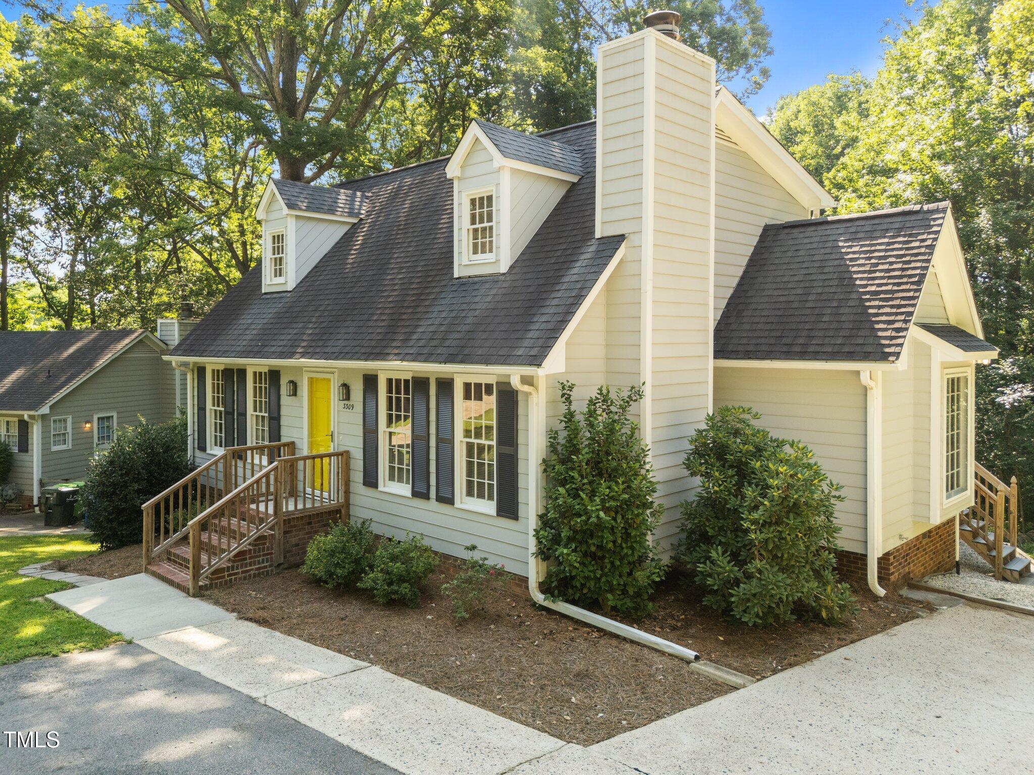 3309 Bearskin Court Raleigh, NC 27606 - Photo 2 of 40 a front view of a house with a yard
