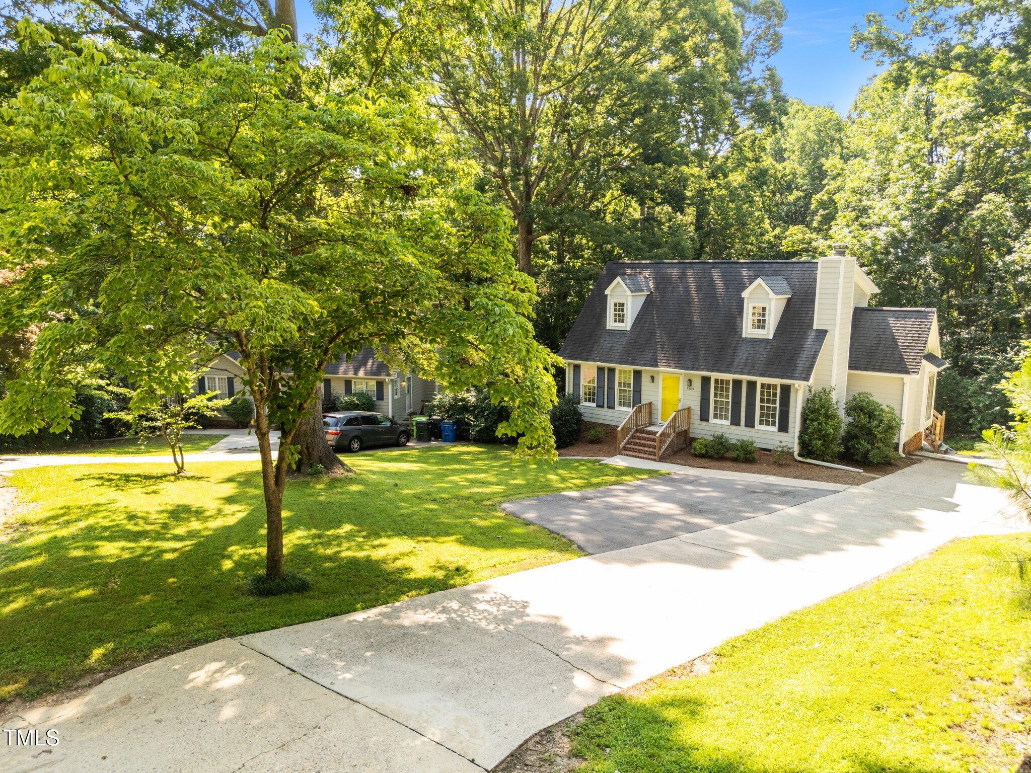 3309 Bearskin Court Raleigh, NC 27606 - Photo 39 of 40 a front view of a house with a yard