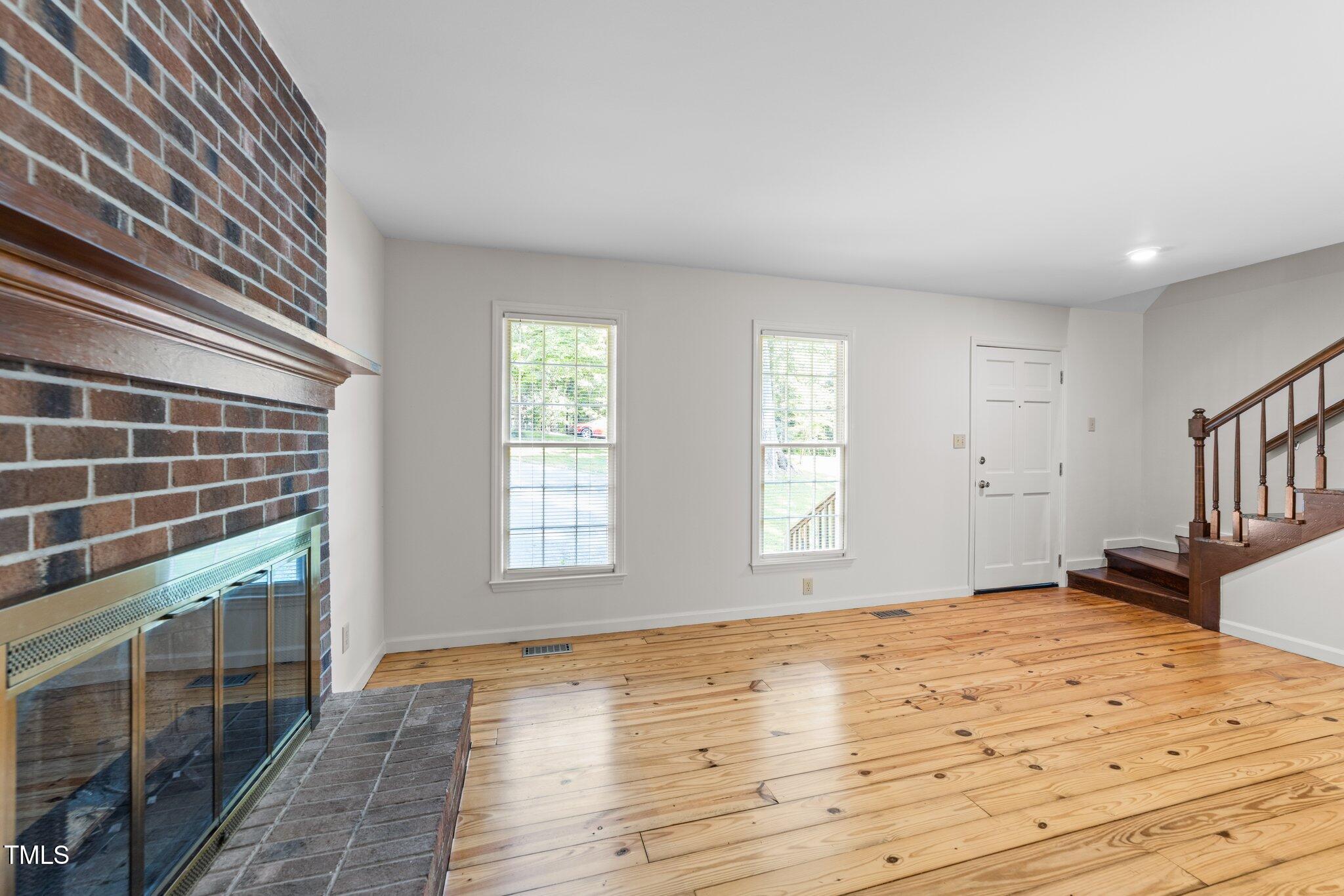 3309 Bearskin Court Raleigh, NC 27606 - Photo 4 of 40 a view of empty room with window and ceiling fan