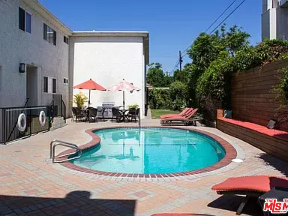 2721 2nd Street, Unit 207 Santa Monica, CA 90405 - Photo 5 of 11 a view of a swimming pool with chairs