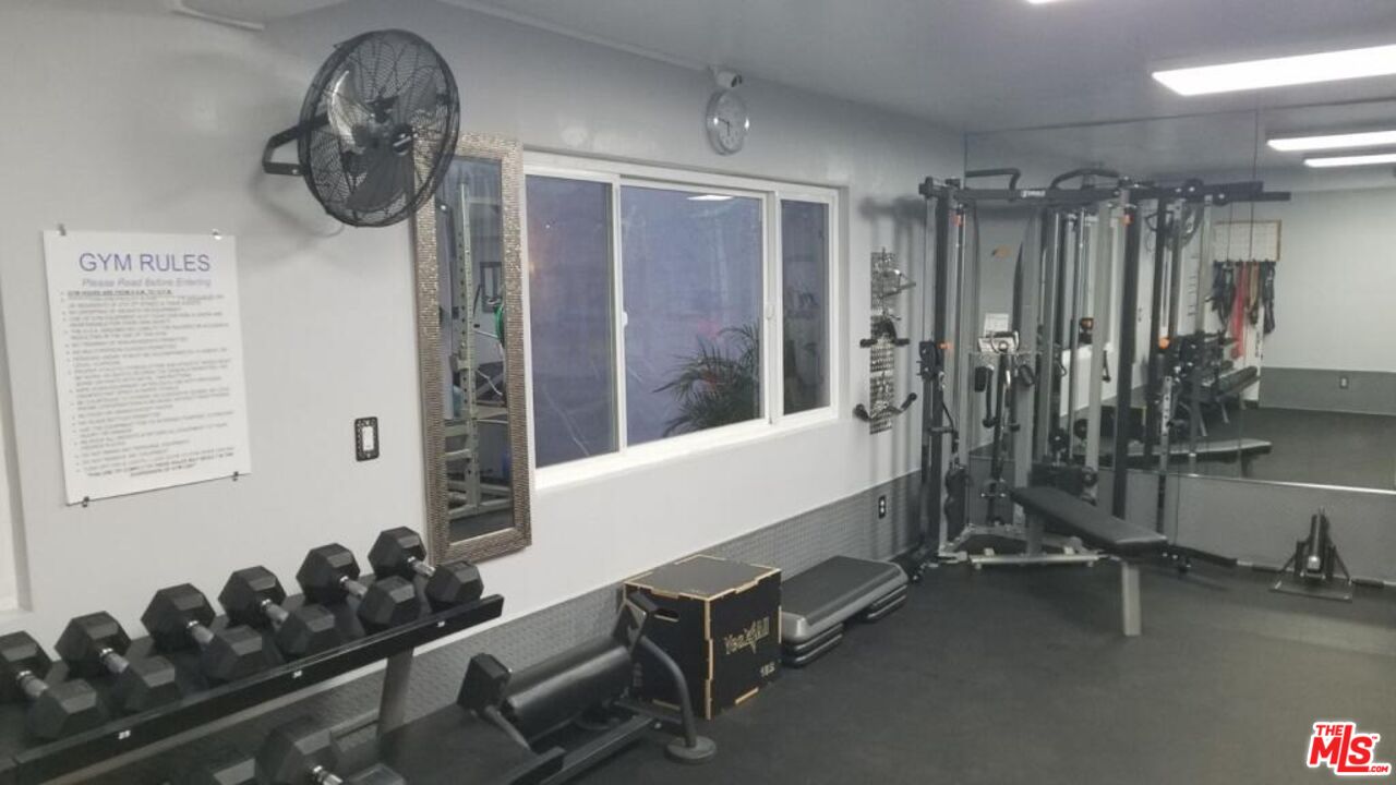 2721 2nd Street, Unit 207 Santa Monica, CA 90405 - Photo 9 of 11 a room with gym equipment and a large window