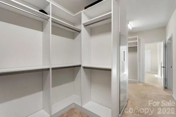 a view of an empty walk in closet