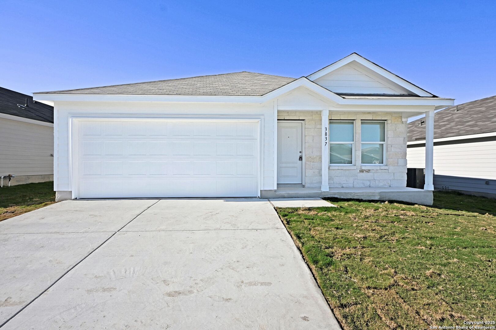 a front view of a house with garden
