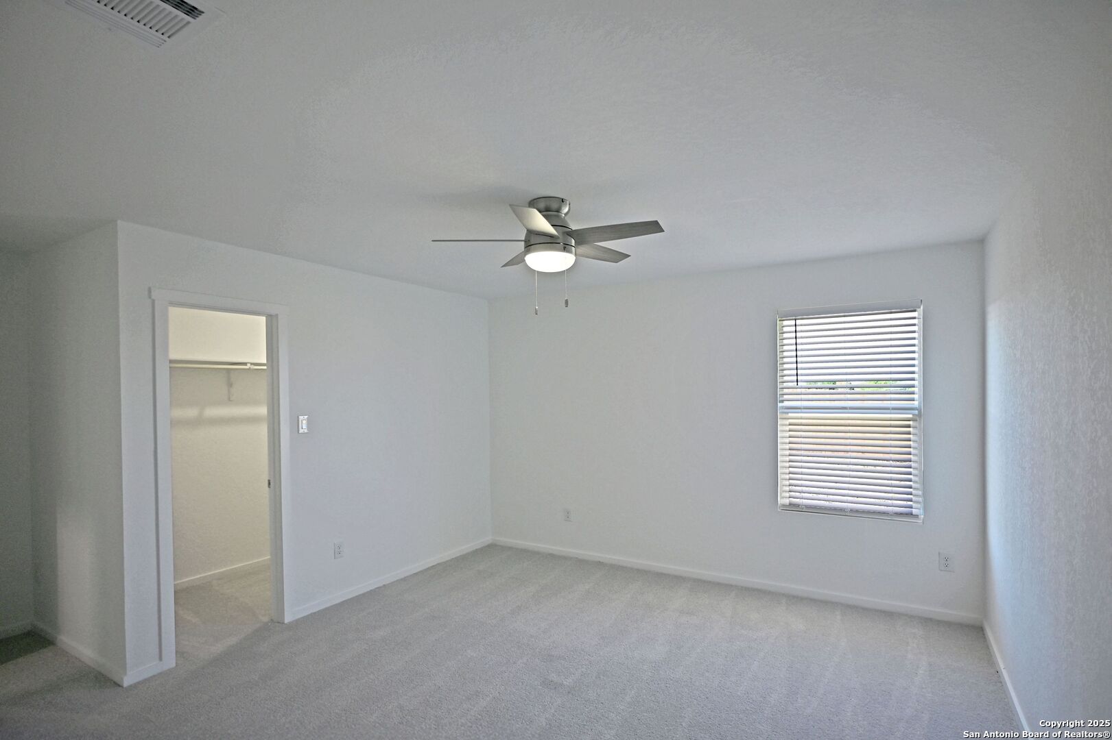 3837 Low Tide Seguin, TX 78155 - Photo 13 of 20 an empty room with a window and a ceiling fan