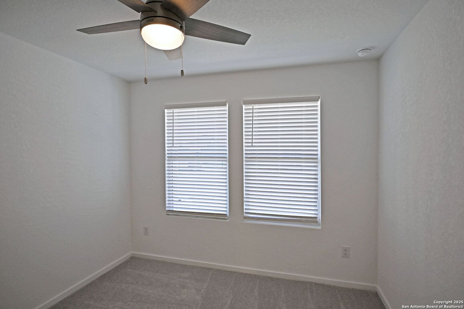 3837 Low Tide Seguin, TX 78155 - Photo 3 of 20 an empty room with a window and a fan