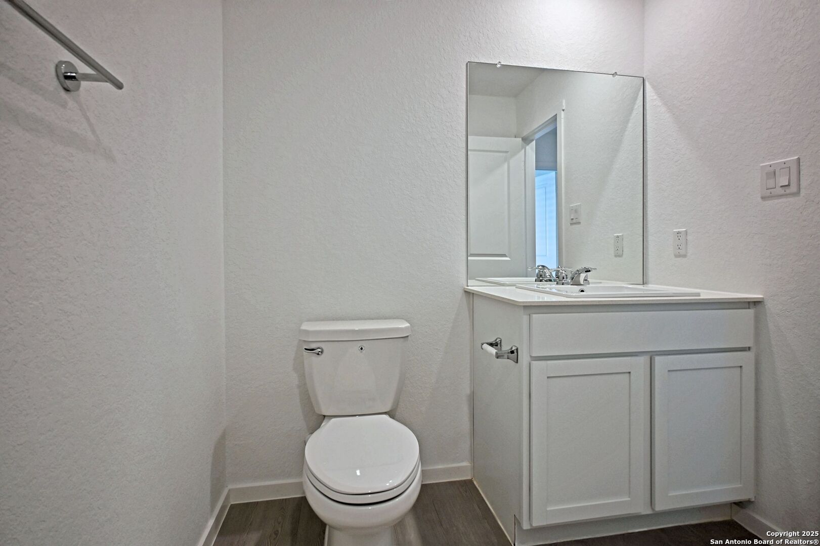3837 Low Tide Seguin, TX 78155 - Photo 6 of 20 a bathroom with a toilet sink vanity and mirror