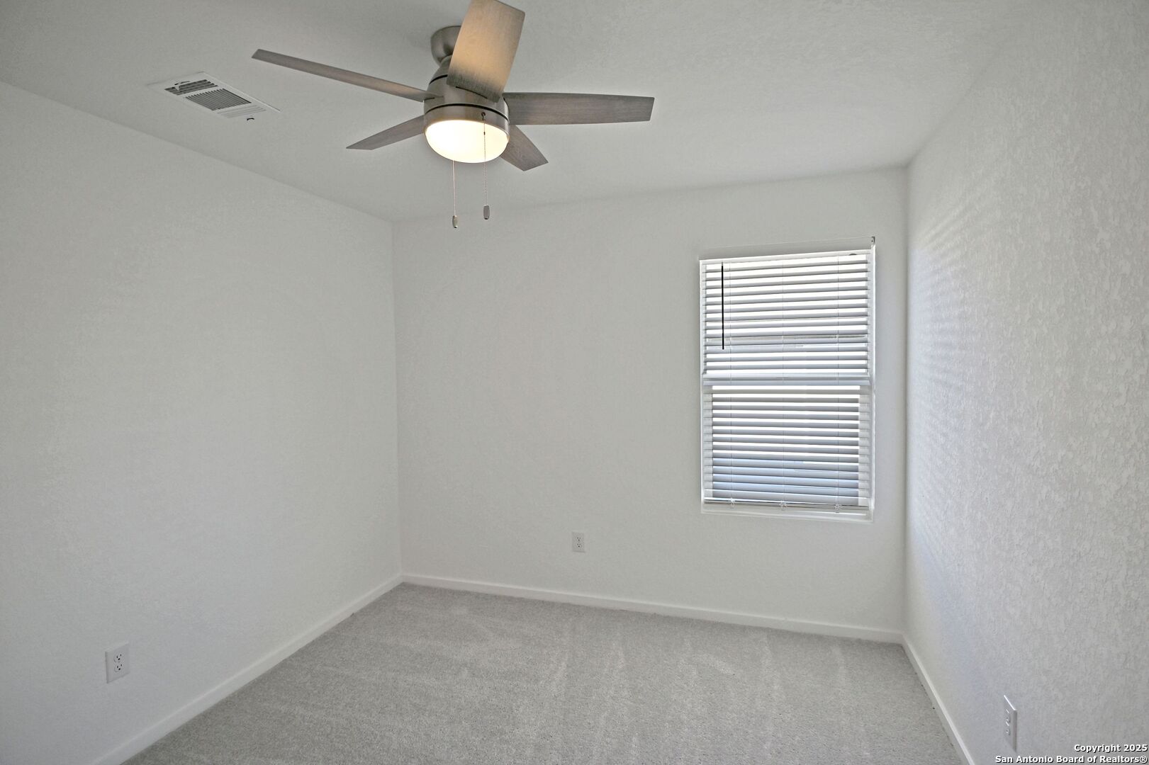 3837 Low Tide Seguin, TX 78155 - Photo 8 of 20 an empty room with a window and a fan