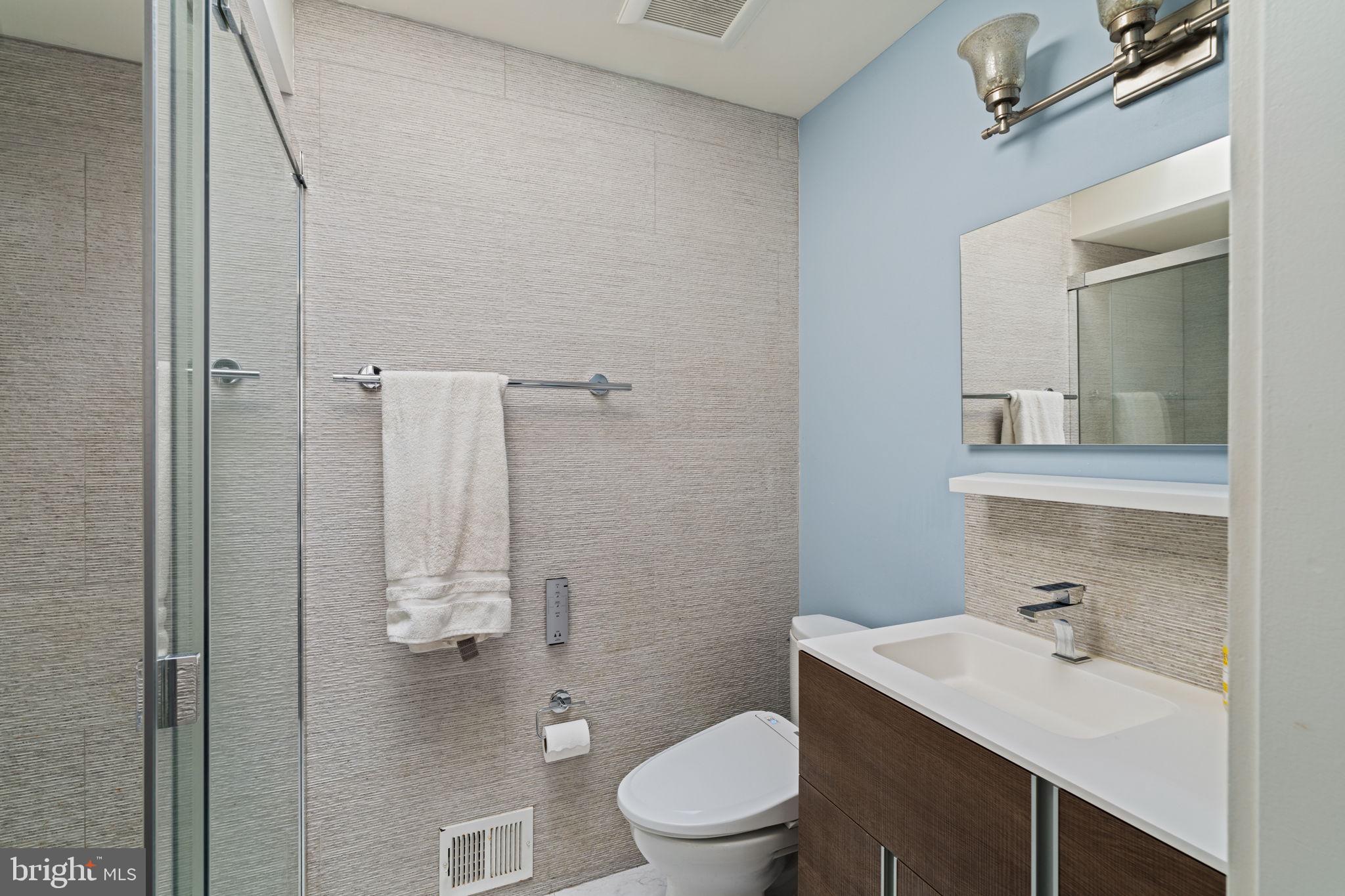 727 North Valley Forge Road Devon, PA 19333 - Photo 52 of 74 a bathroom with a sink vanity mirror and toilet