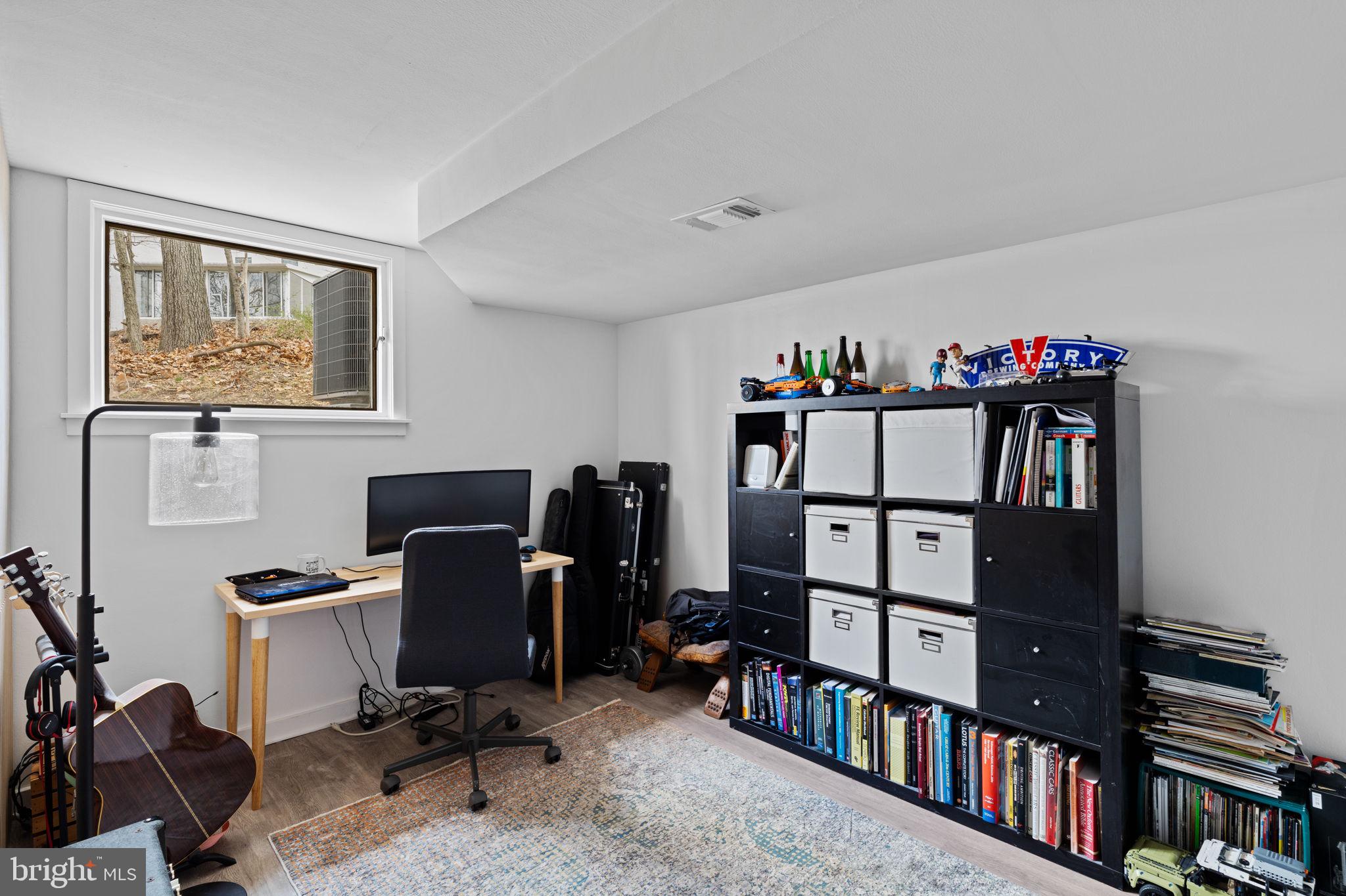 727 North Valley Forge Road Devon, PA 19333 - Photo 71 of 74 a view of a workspace with furniture and a bookshelf