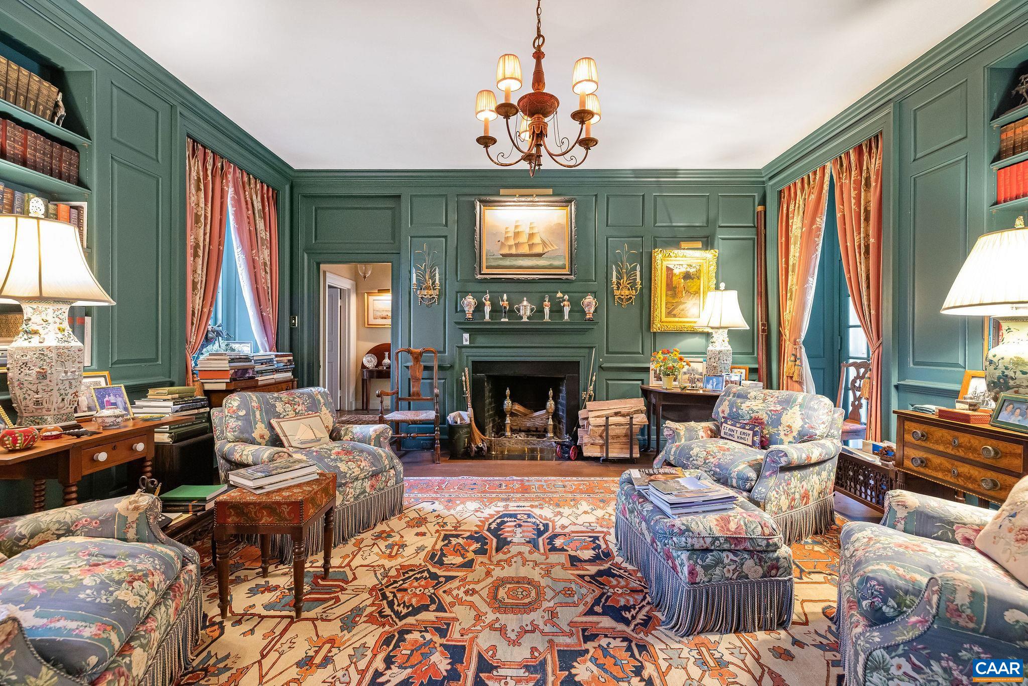 19184 Mt Sharon Road Rapidan, VA 22733 - Photo 18 of 74 a living room with furniture a fireplace and a chandelier