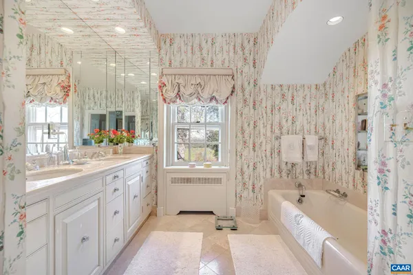 a room with pool table and windows