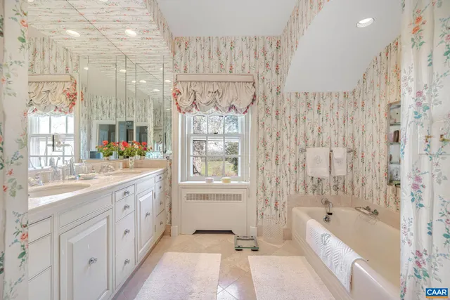 a room with pool table and windows