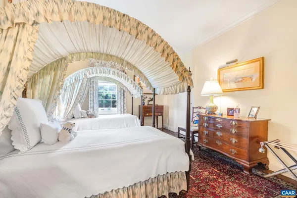 a room with furniture a rug and a window