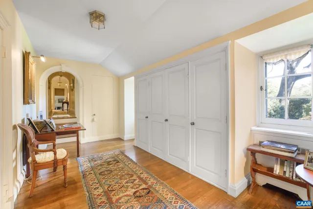 a room with furniture and a book shelf