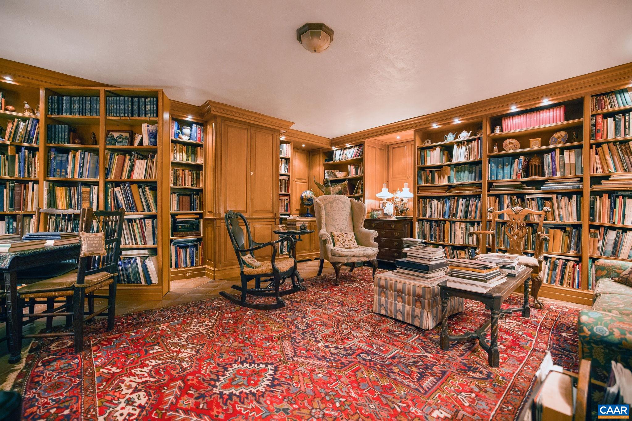 19184 Mt Sharon Road Rapidan, VA 22733 - Photo 37 of 74 a living room with furniture a rug and a book shelf