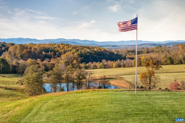 a front view of a residential apartment building with a yard