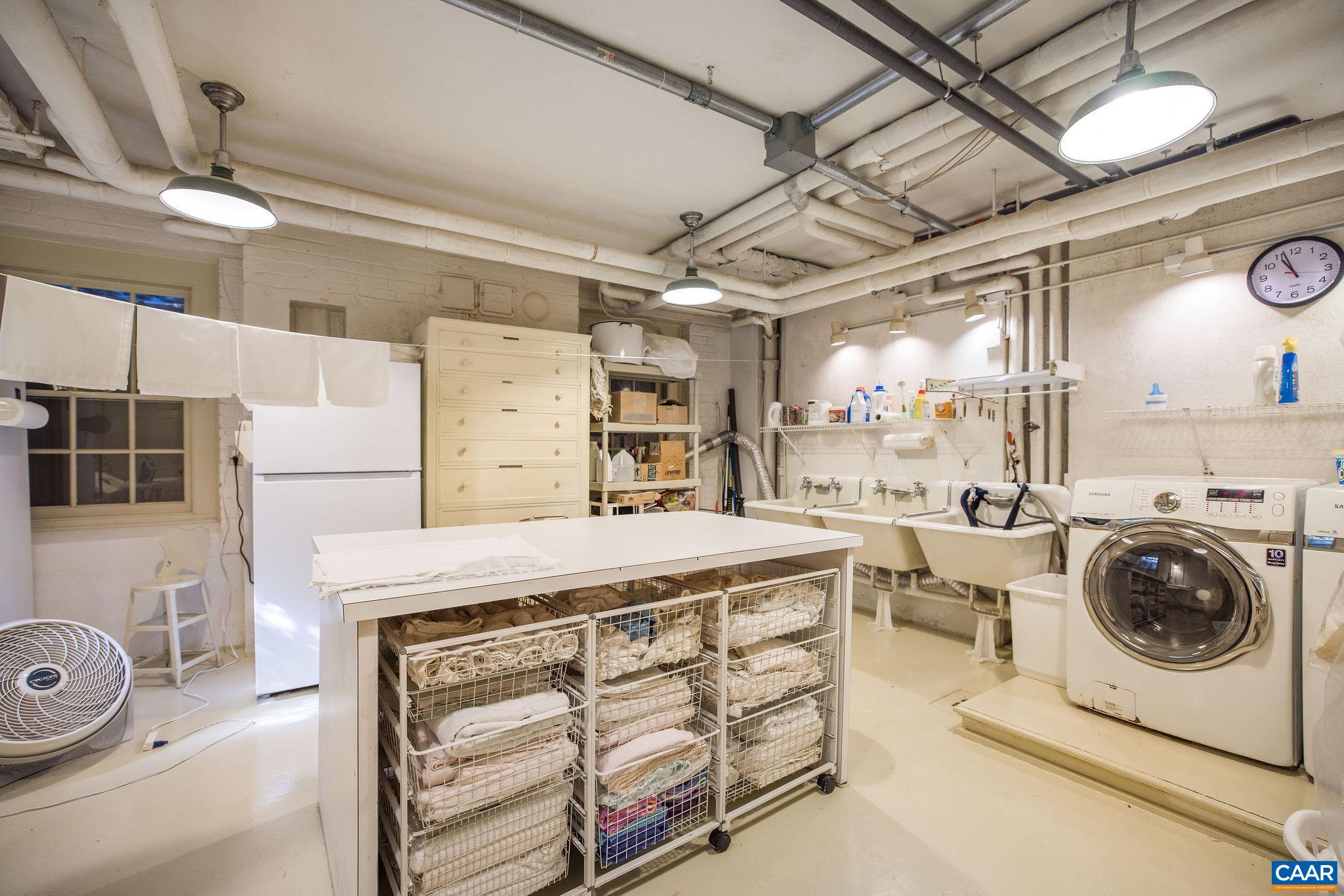 19184 Mt Sharon Road Rapidan, VA 22733 - Photo 41 of 74 a utility room with cabinets dryer and washer