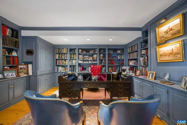 a swimming pool with outdoor seating and yard