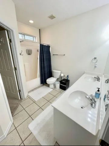 a bathroom with a sink and a large mirror
