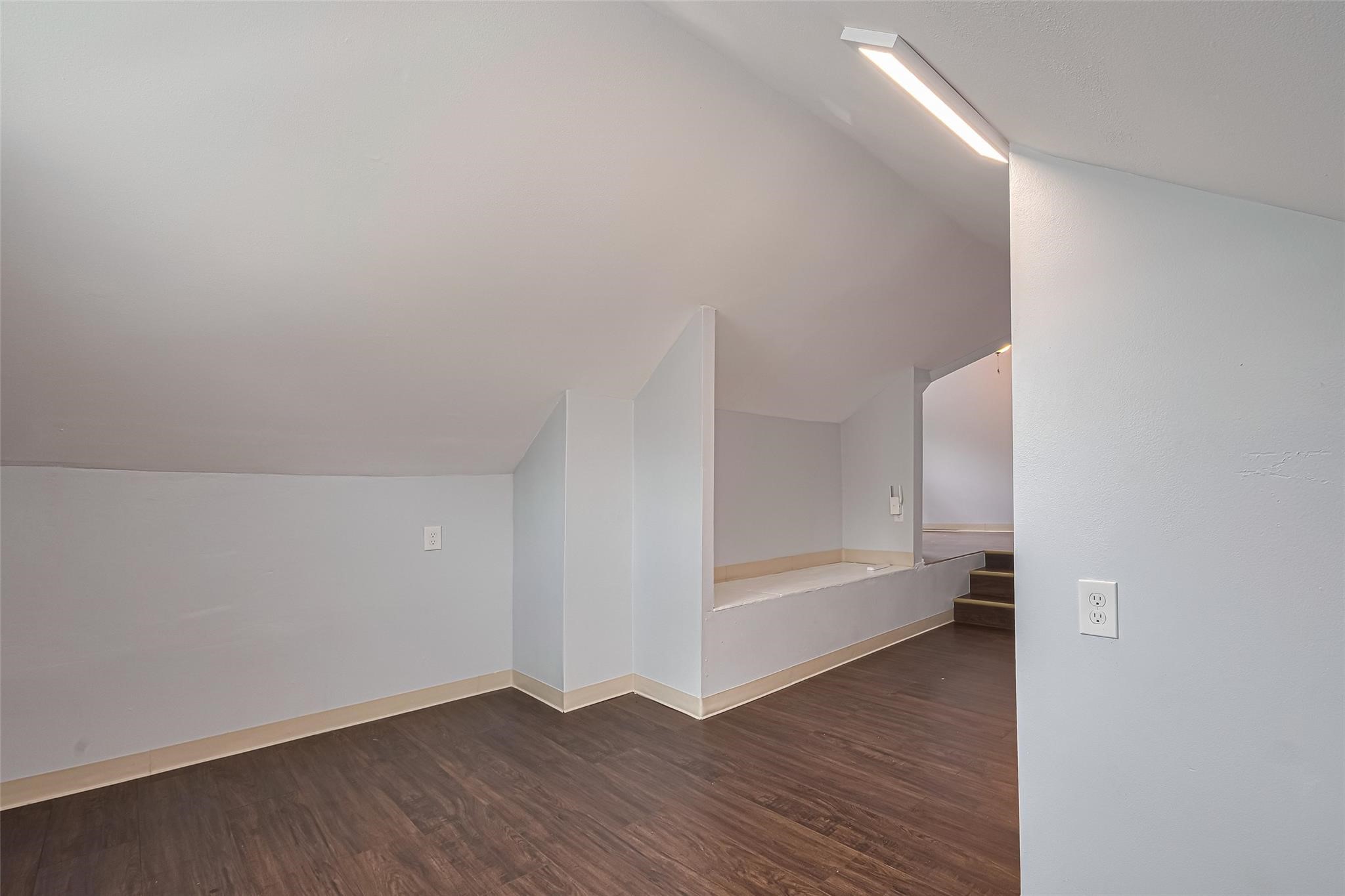 845 Columbia Street, Unit C Houston, TX 77007 - Photo 9 of 12 a view of an empty room with wooden floor and a window