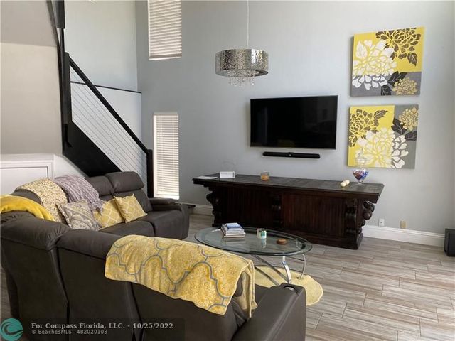a bathroom with a double vanity sink mirror and shower