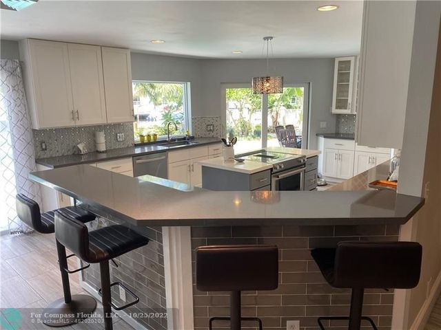 a bathroom with a toilet and a mirror