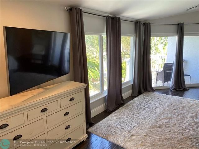 a bedroom with a bed and cabinets