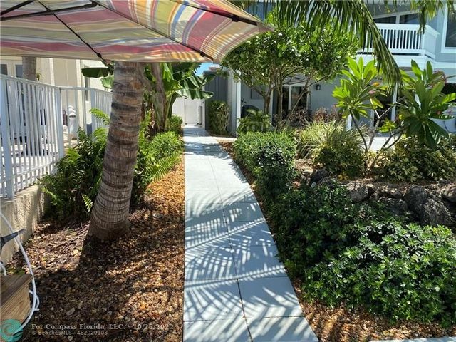 a house with a tree in front of it