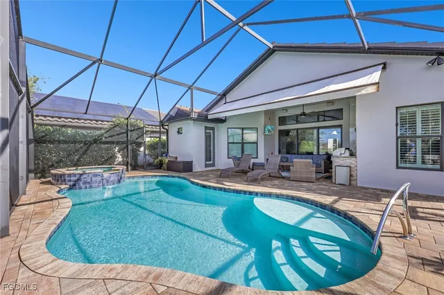 a view of a swimming pool with a patio