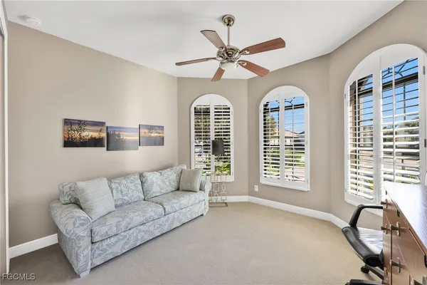 a living room with furniture and windows