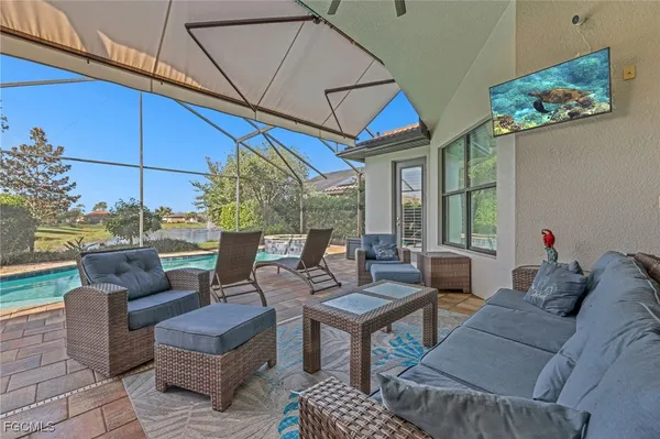 a living room with furniture a fireplace and a table