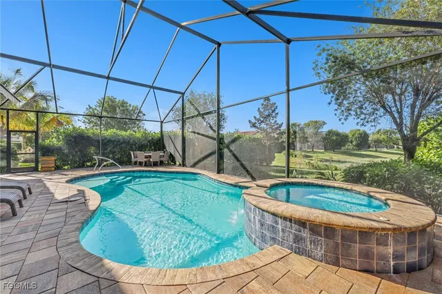 a view of a swimming pool with a yard