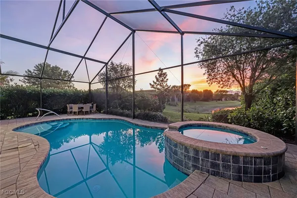 a view of a swimming pool with a patio