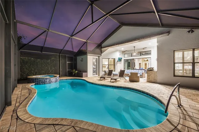 a view of a dining room with furniture wooden floor and a fireplace