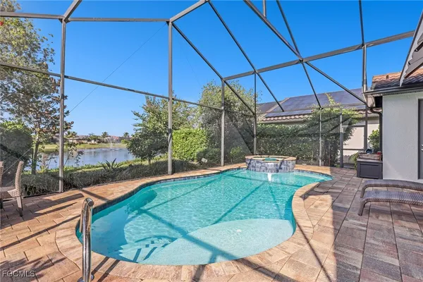 a view of a backyard with sitting area