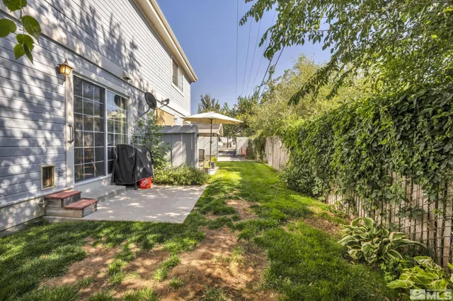 a view of a brick house with a yard