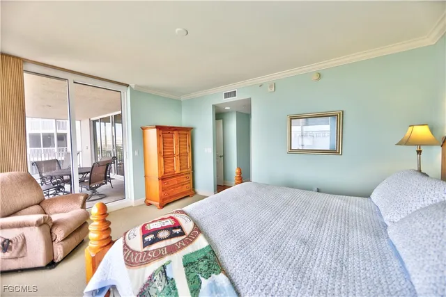 a bedroom with a bed and a couch