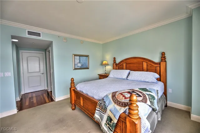 a bedroom with a bed and a dresser