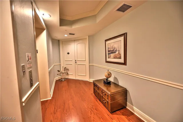 a living room with a couch and a chandelier