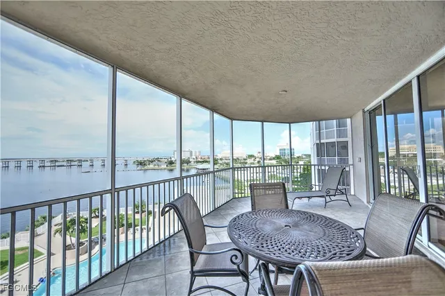 a dining room with furniture window and outside view