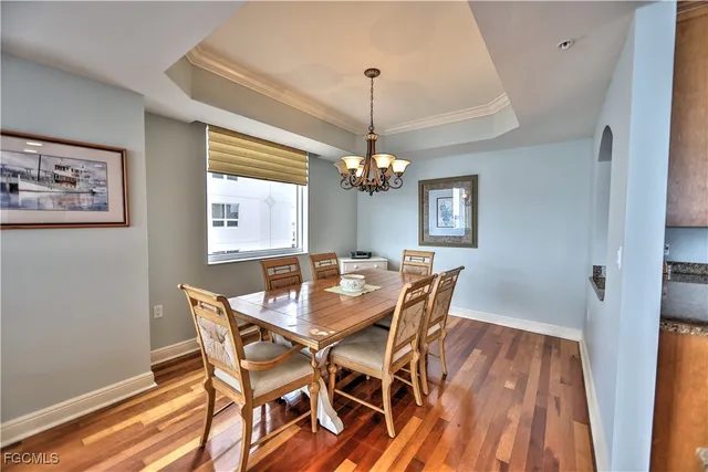 a view of a dining room with furniture and window