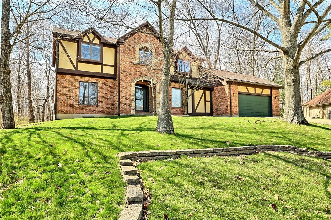 8711 Nicole Lane Springboro, OH 45066 - Photo 3 of 87 This charming home features a brick exterior and a well-maintained lawn.