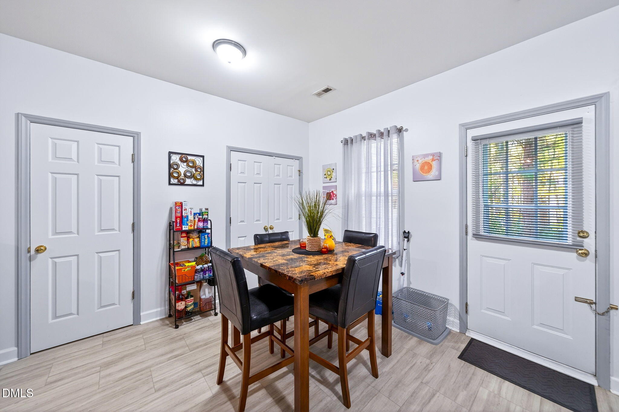 6010 San Marcos Way Raleigh, NC 27616 - Photo 12 of 22 a view of a dining room with furniture and wooden floor