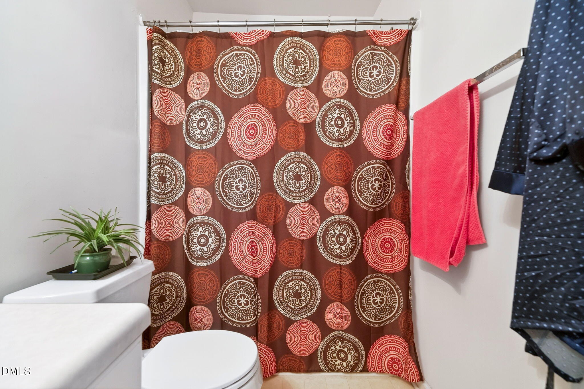 6010 San Marcos Way Raleigh, NC 27616 - Photo 18 of 22 a bathroom with a toilet and a shower curtain