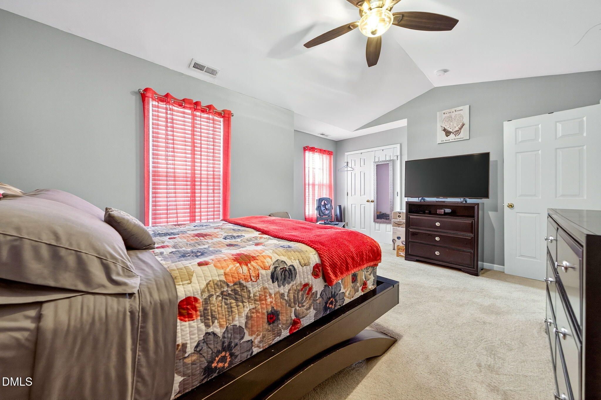 6010 San Marcos Way Raleigh, NC 27616 - Photo 20 of 22 a bedroom with a bed a chandelier and a flat screen tv