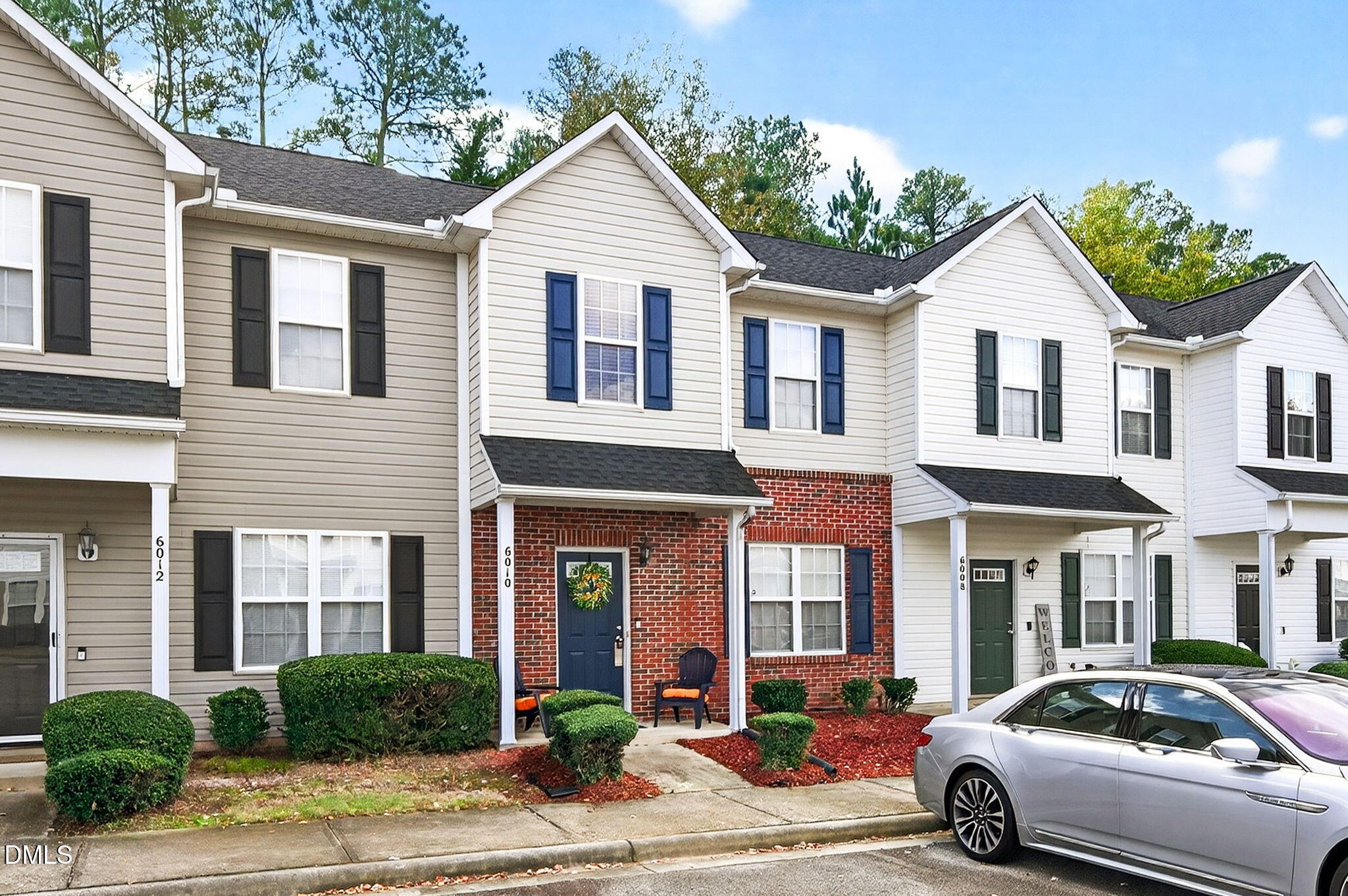 6010 San Marcos Way Raleigh, NC 27616 - Photo 2 of 22 a view of a white car parked in front of a brick house