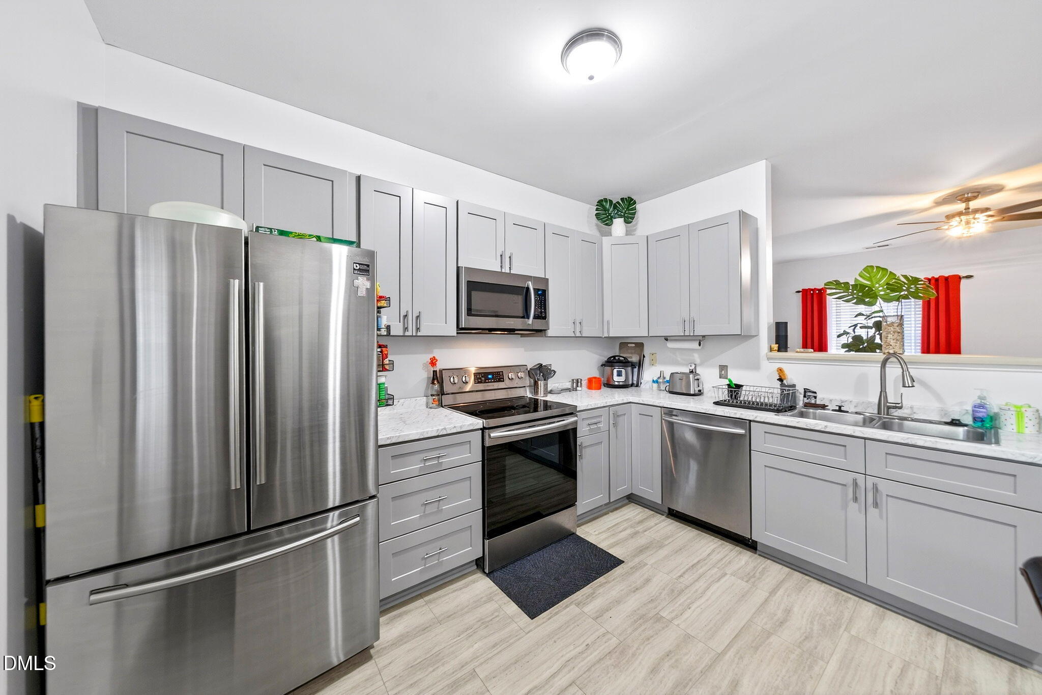 6010 San Marcos Way Raleigh, NC 27616 - Photo 10 of 22 a kitchen with a refrigerator sink and microwave