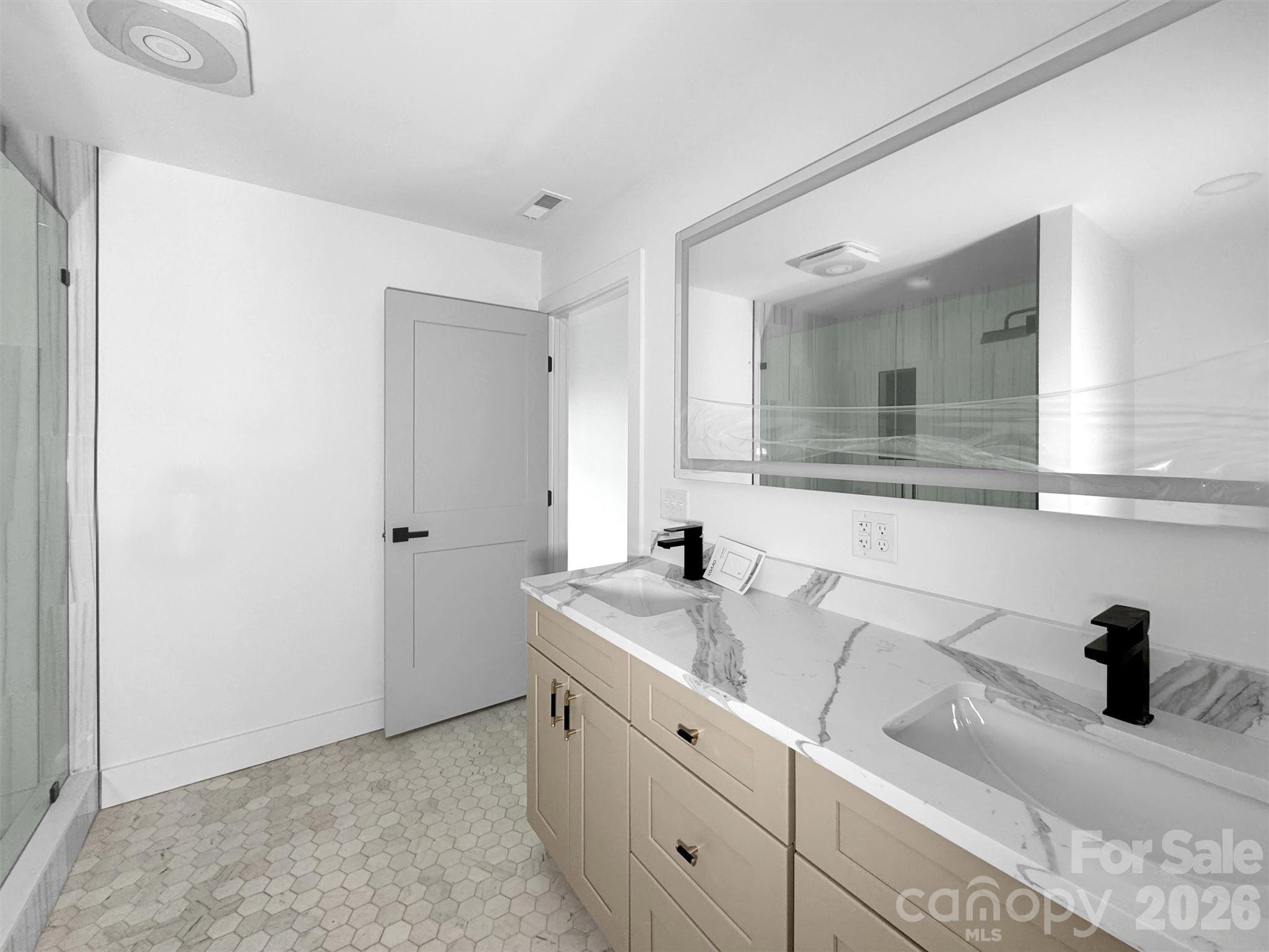 1351 Old Country Road Waynesville, NC 28786 - Photo 13 of 28 a bathroom with a sink and a mirror