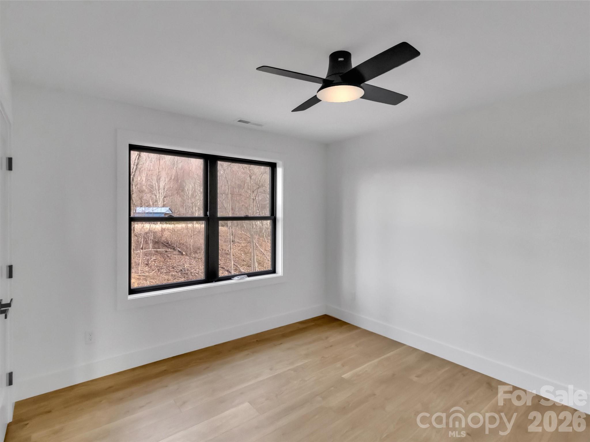 1351 Old Country Road Waynesville, NC 28786 - Photo 16 of 28 an empty room with a window