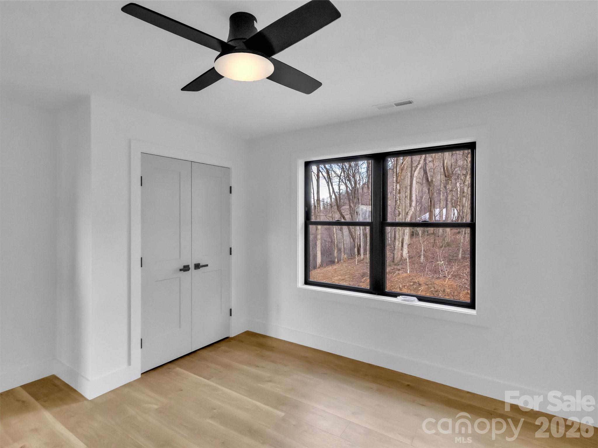 1351 Old Country Road Waynesville, NC 28786 - Photo 17 of 28 a view of an empty room with a window